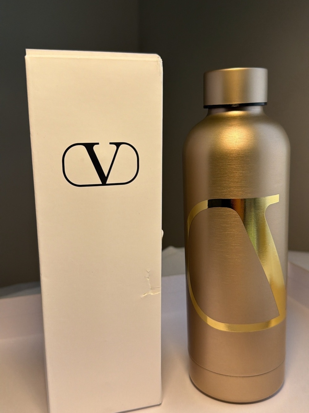 New,unused & authentic Valentino Metallic Gold Bottle with Shiny Gold V Logo